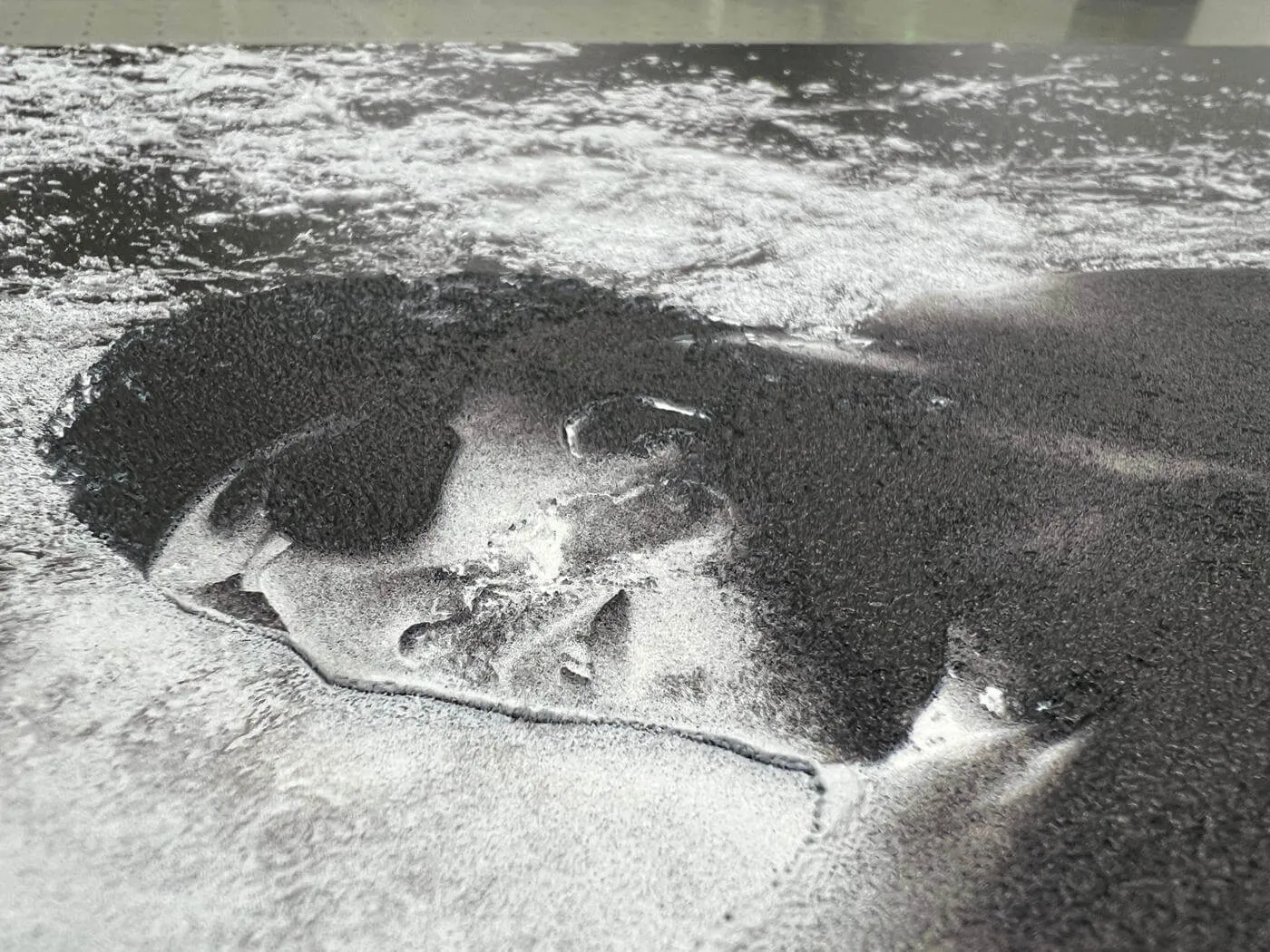 Black and white graphic with dimensional raised UV texture for the Canon project