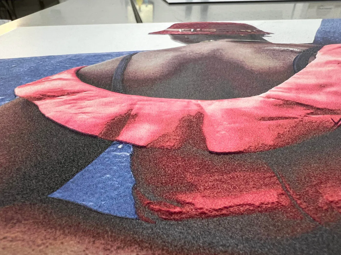 Close-up of dimensional colour UV printing with raised tactile details