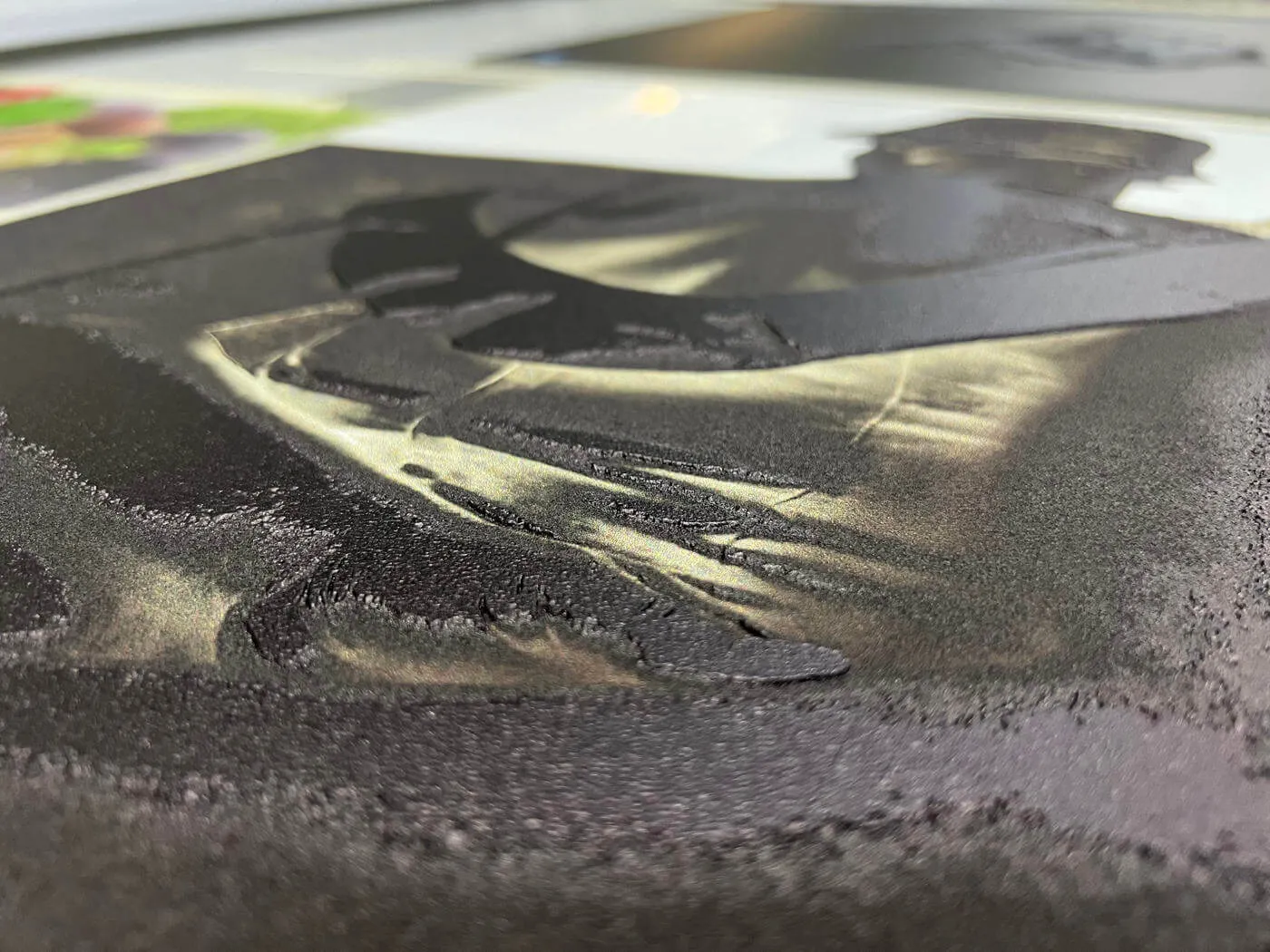 Detailed view of dimensional UV printing creating a raised tactile surface