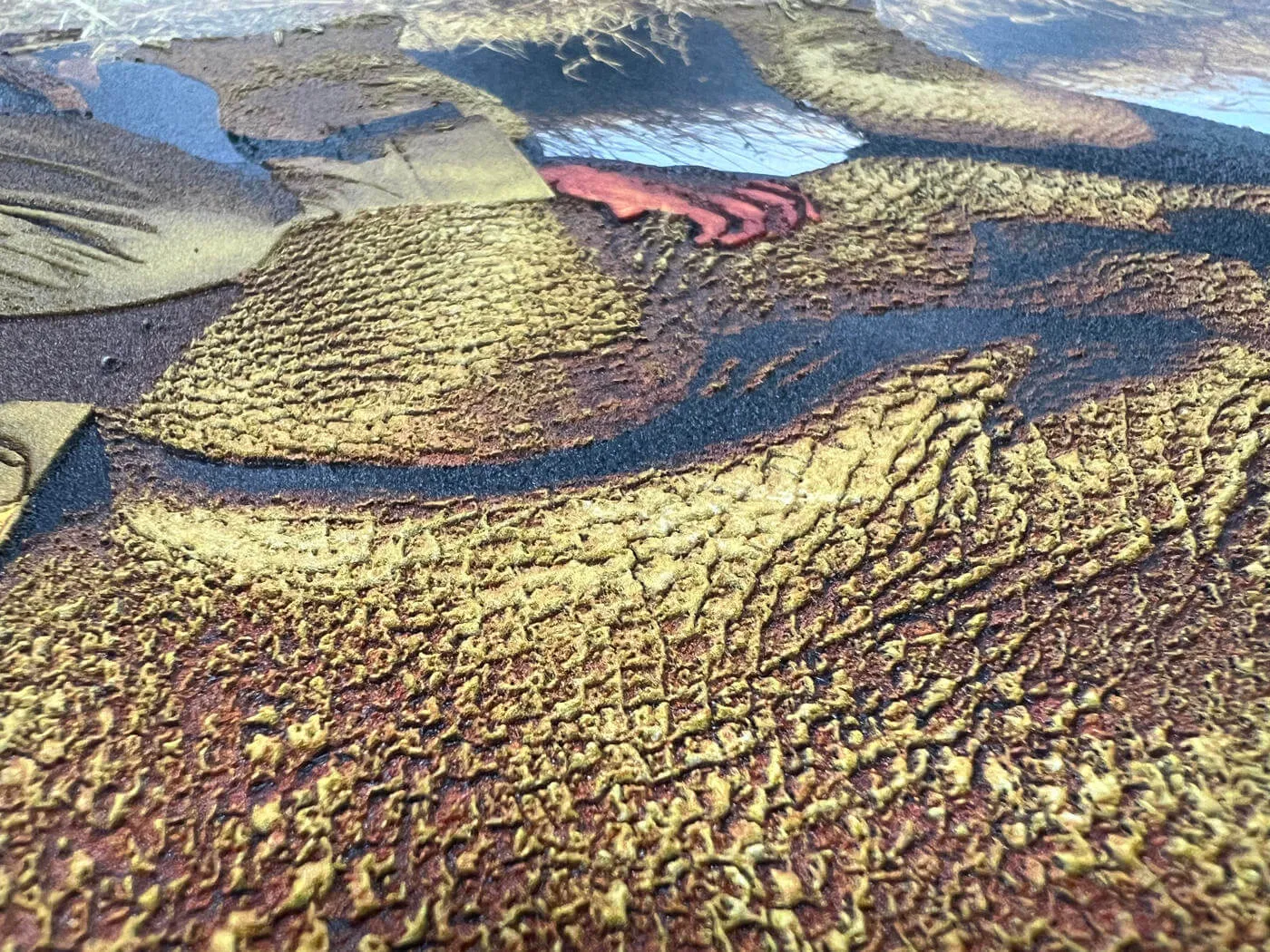 Close-up of textured and raised UV printing on a full-colour graphic