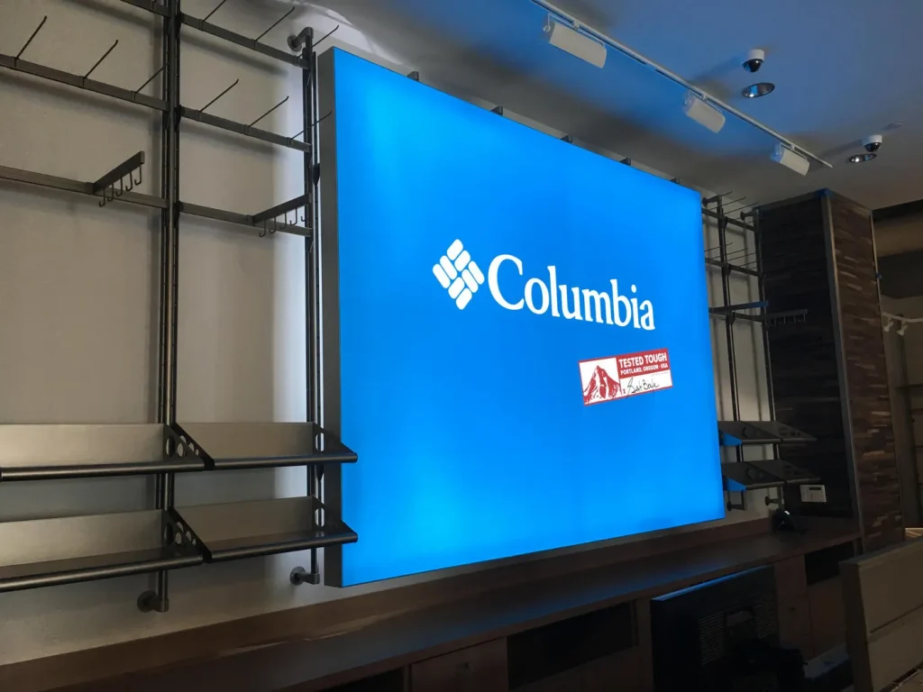 Blue Columbia Sportswear logo lightbox installed inside a retail store