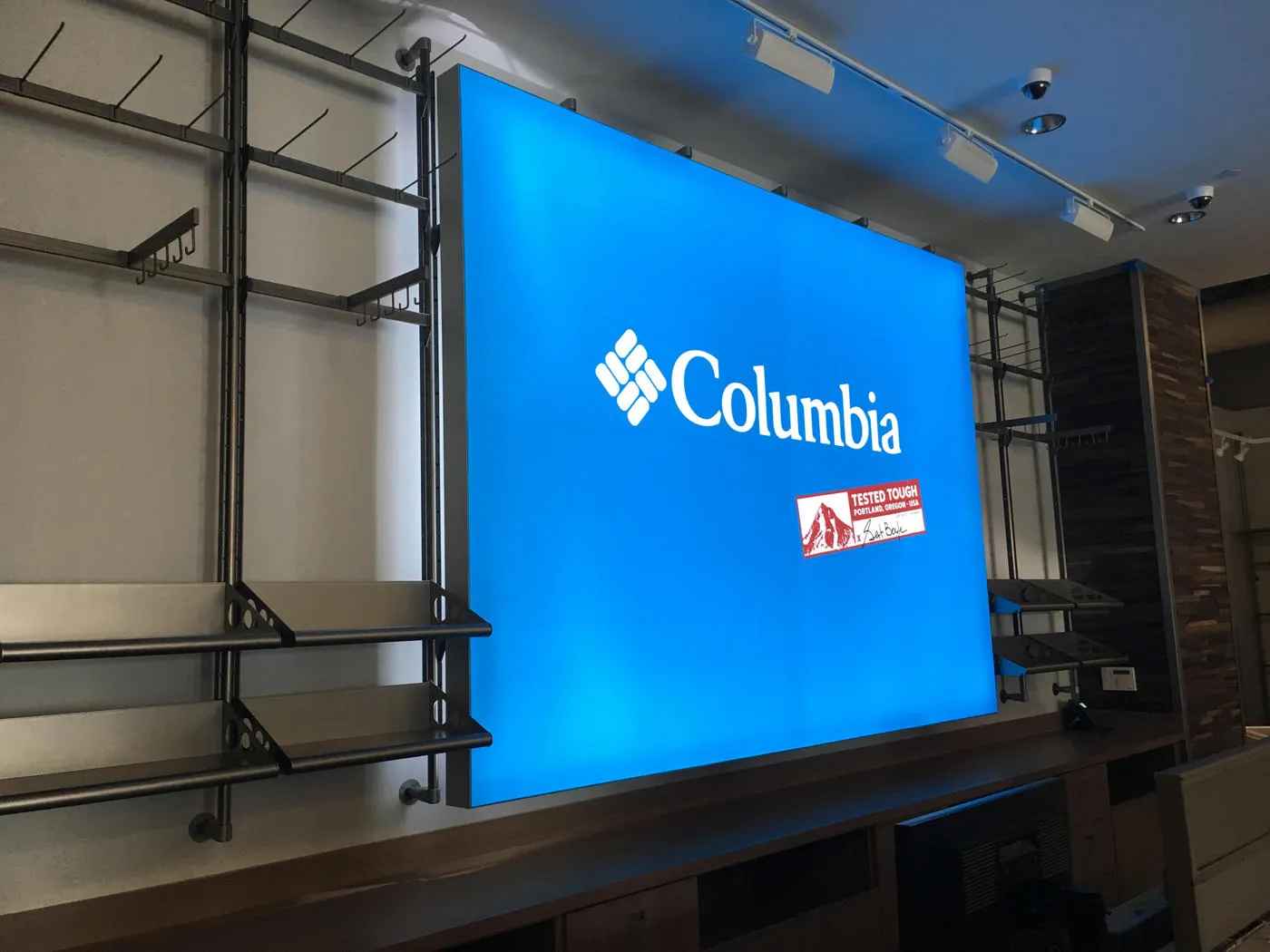 Blue Columbia Sportswear logo lightbox installed inside a retail store