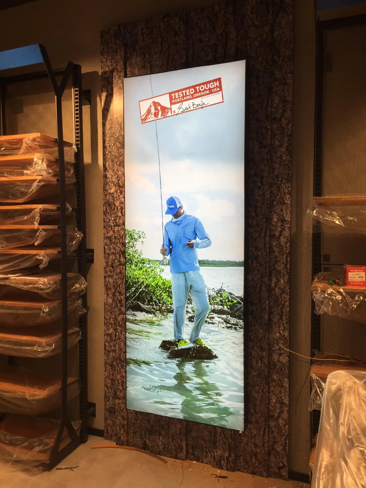 Vertical Columbia Tested Tough lightbox featuring an angler wearing outdoor clothing