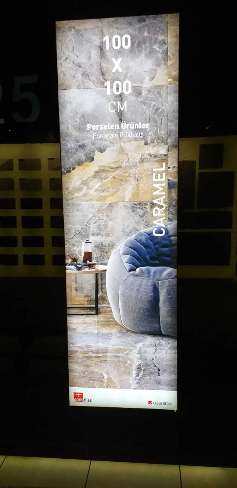 Illuminated porcelain tile display panel featuring a marble interior design