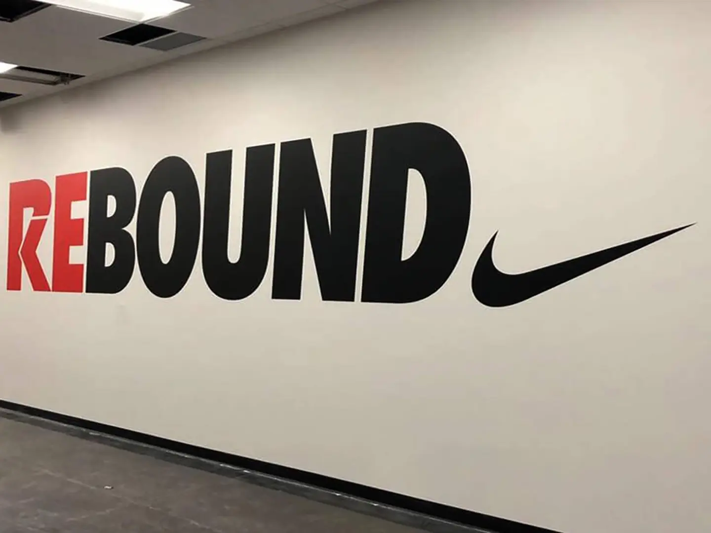 Large-format Nike wall graphics for a branded retail environment