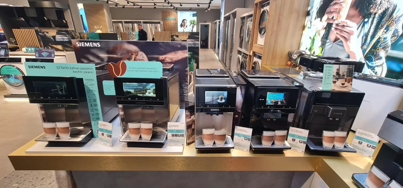 Siemens coffee machine retail display with coordinated POP POS graphics and product information cards