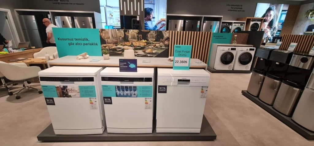 Siemens dishwasher retail display featuring promotional panels and product information graphics