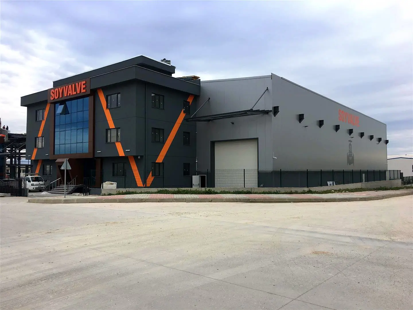 Soyvalve signage on the front and side of a factory building