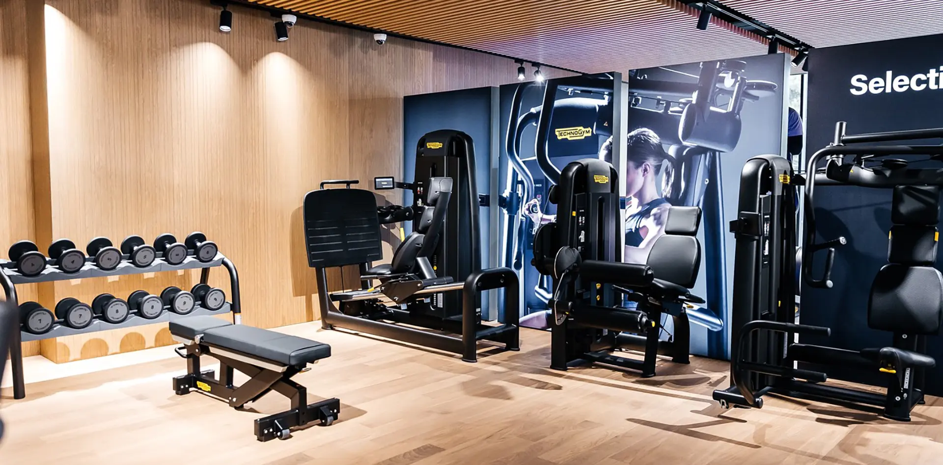 Technogym freestanding illuminated graphic display inside fitness showroom