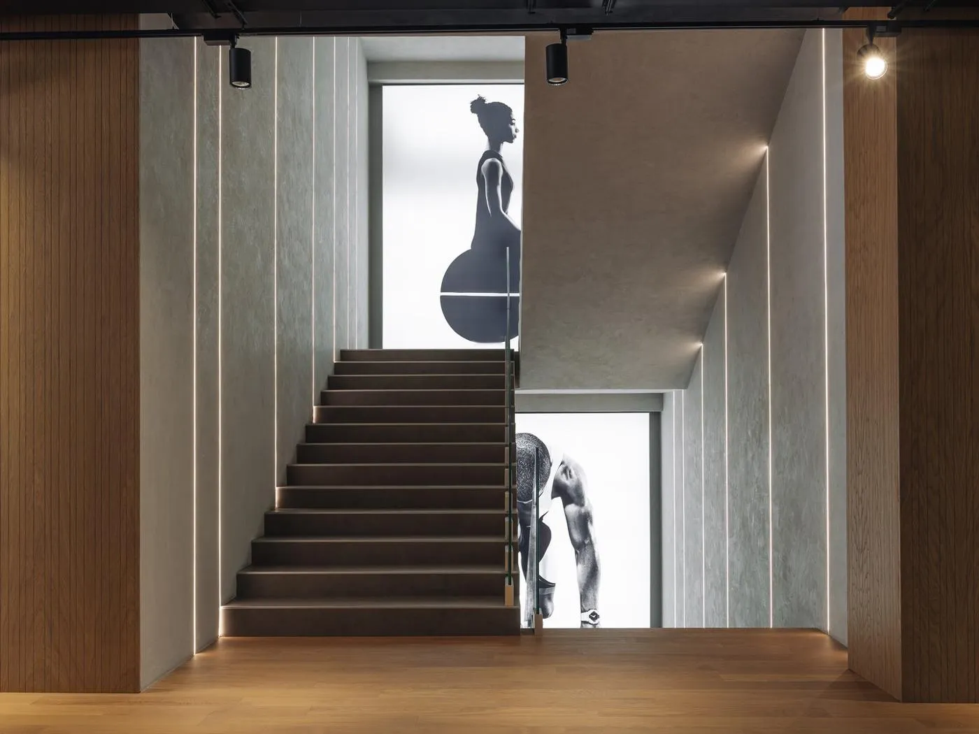 Technogym illuminated graphics installed beside the showroom staircase