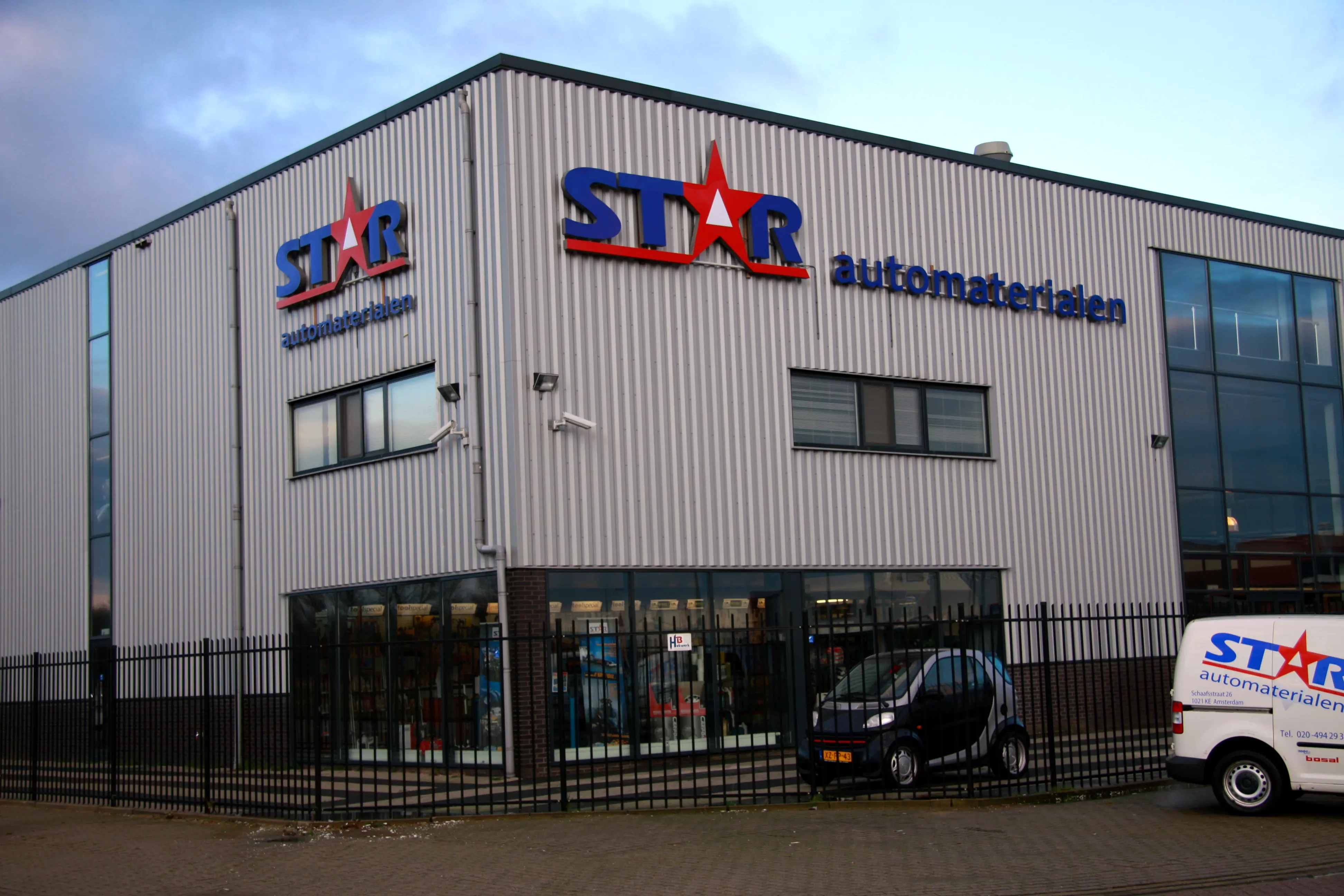 STAR Automaterialen building with facade signs visible in daylight